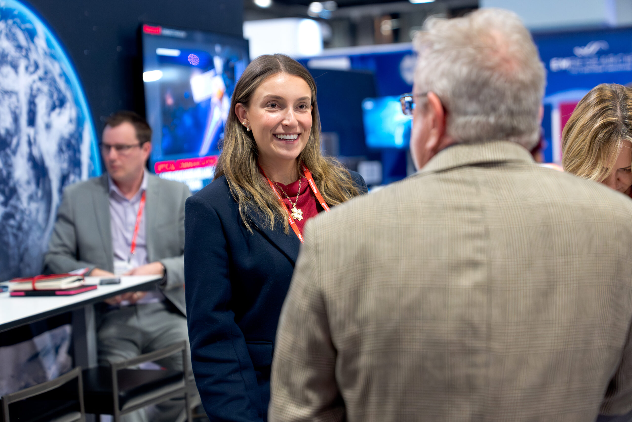 Exhibitor in conversation with an attendee at a booth